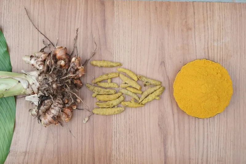 Yellow roots and yellow powder on a wooden board